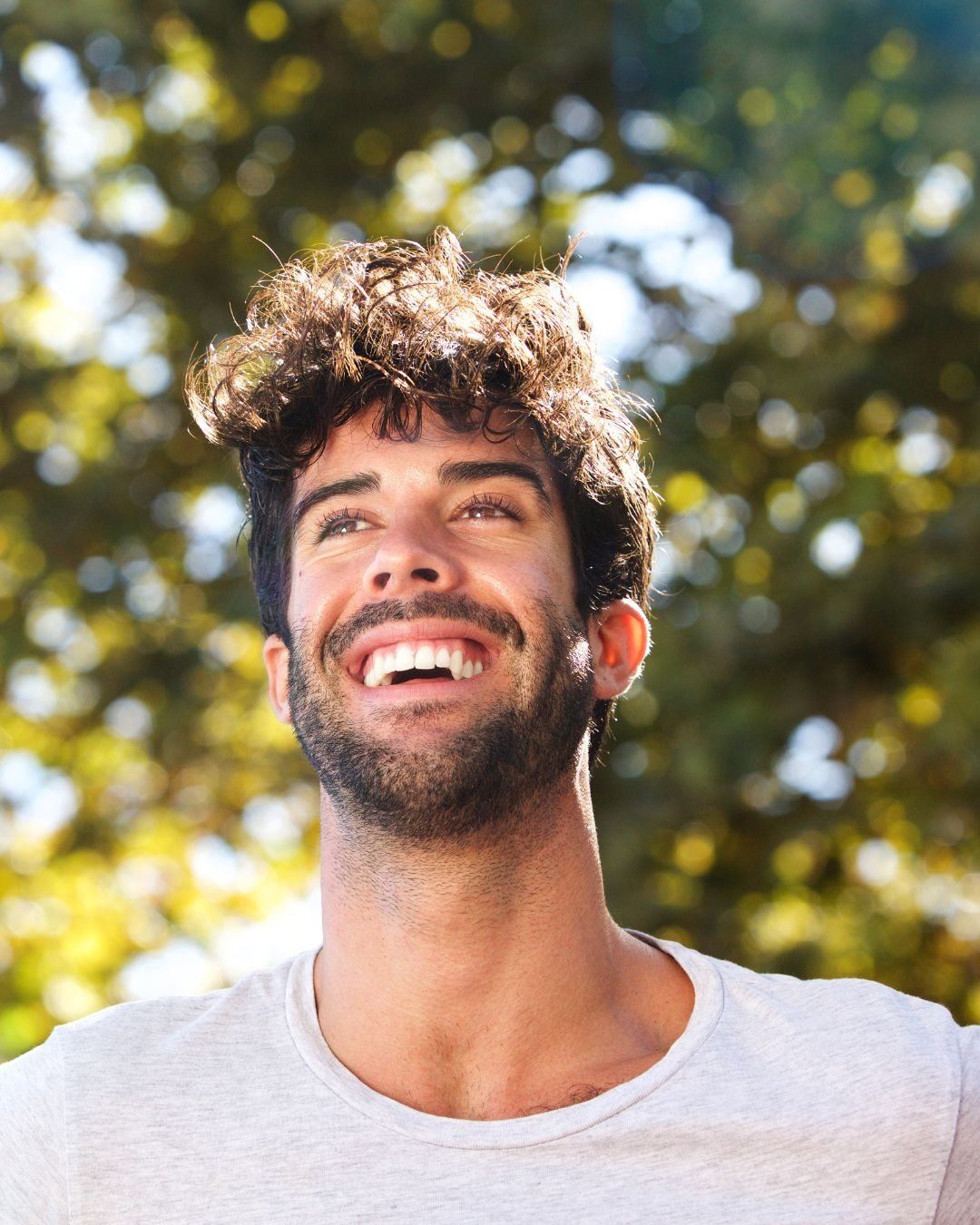 Smiling man outdoors on a sunny day