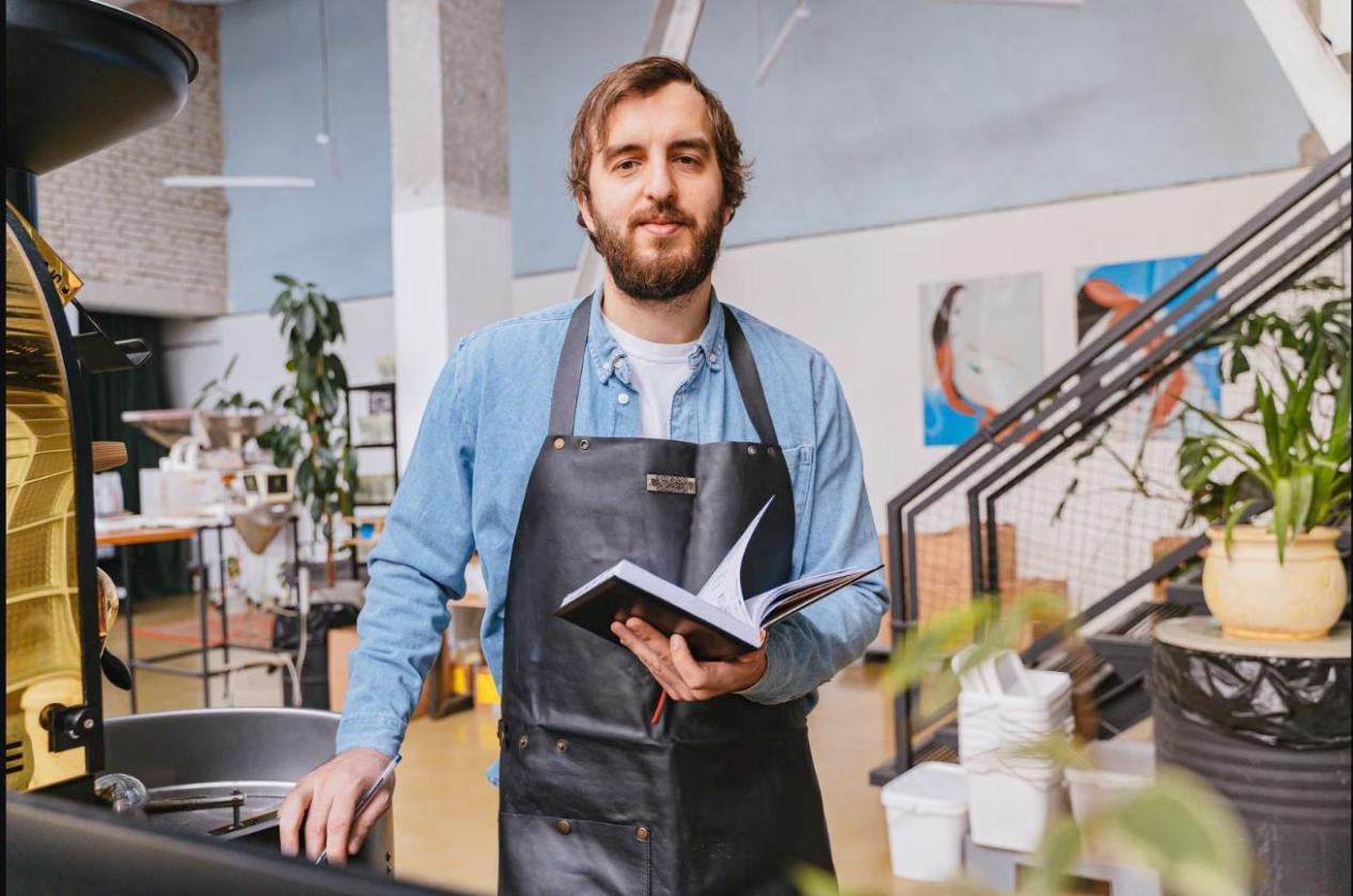 Self-employed shop owner reviewing his notes